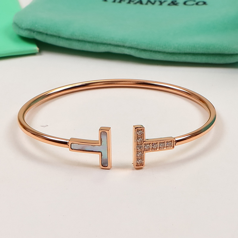 Replica Tiffany half-drilled half-white shell letter open bangle
