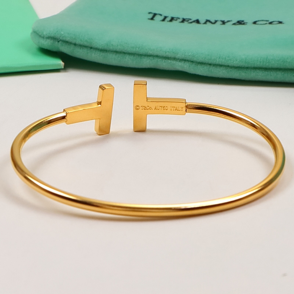 Replica Tiffany half-drilled half-white shell letter open bangle