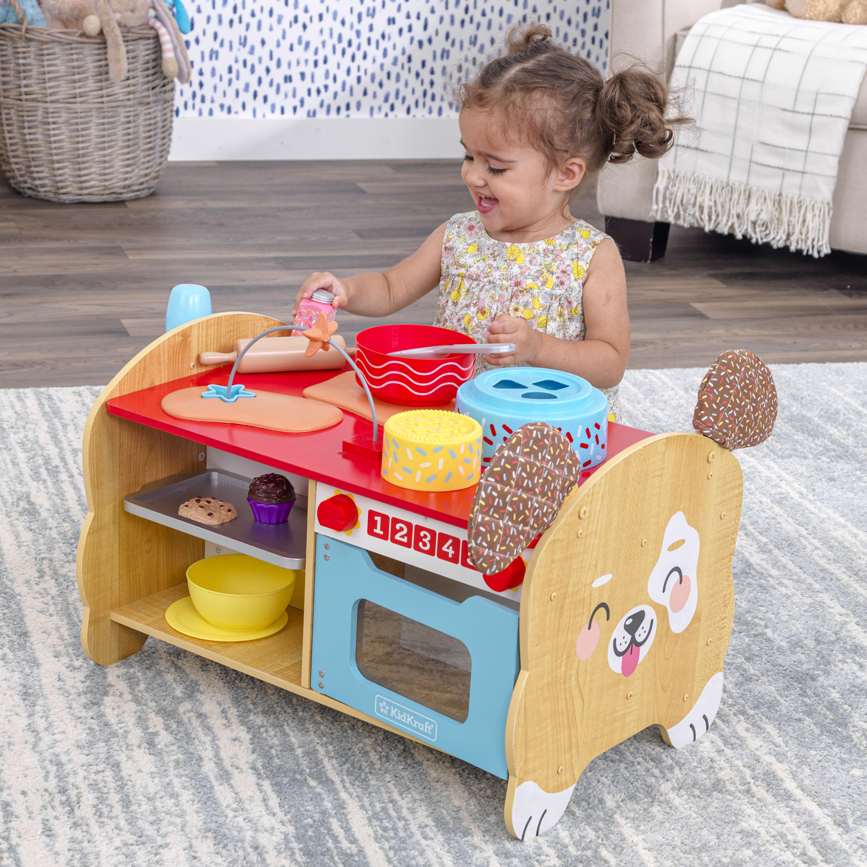 KidKraft Foody Friends: Baking Fun Puppy Wooden Toddler Activity Center with 20 Accessories