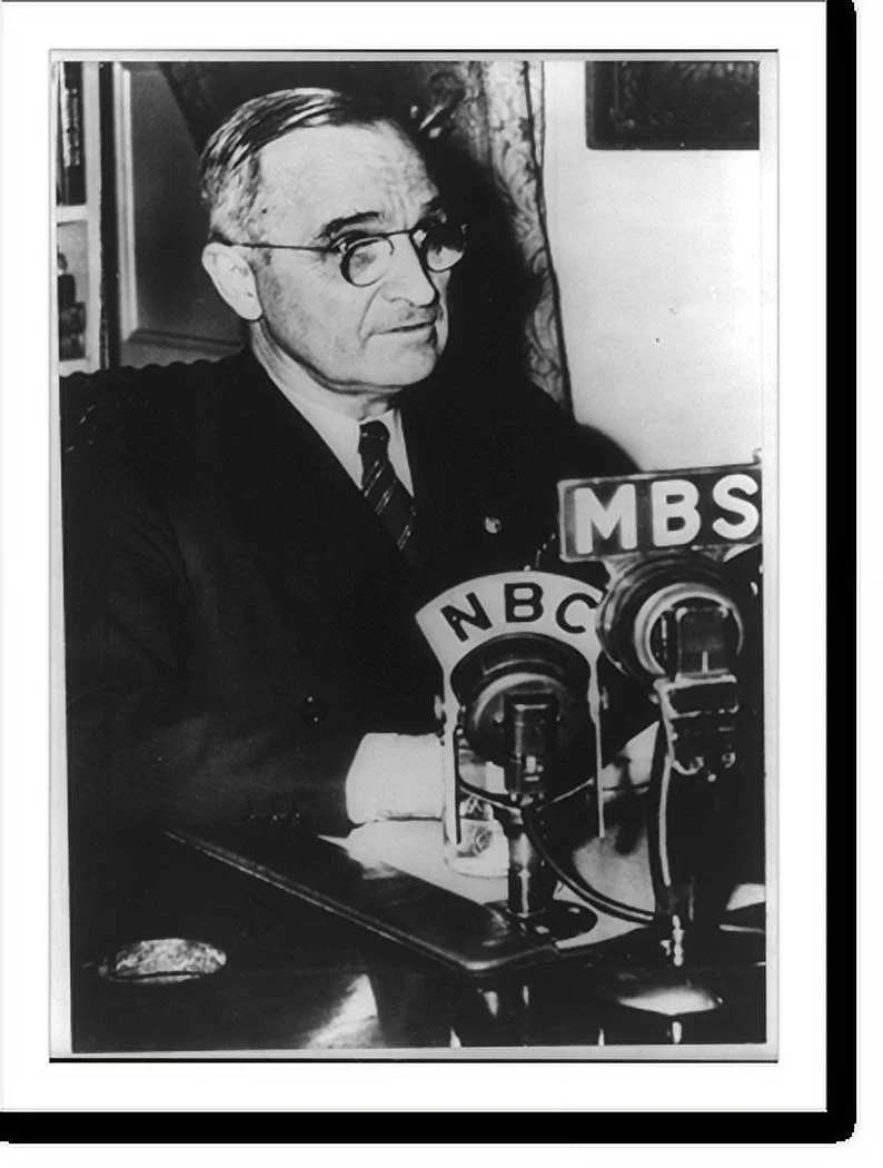 Historic Framed Print, [Harry S. Truman, head and shoulders, facing right, making radio broadcast to Armed Forces on April 17, 1945], 17-7/8