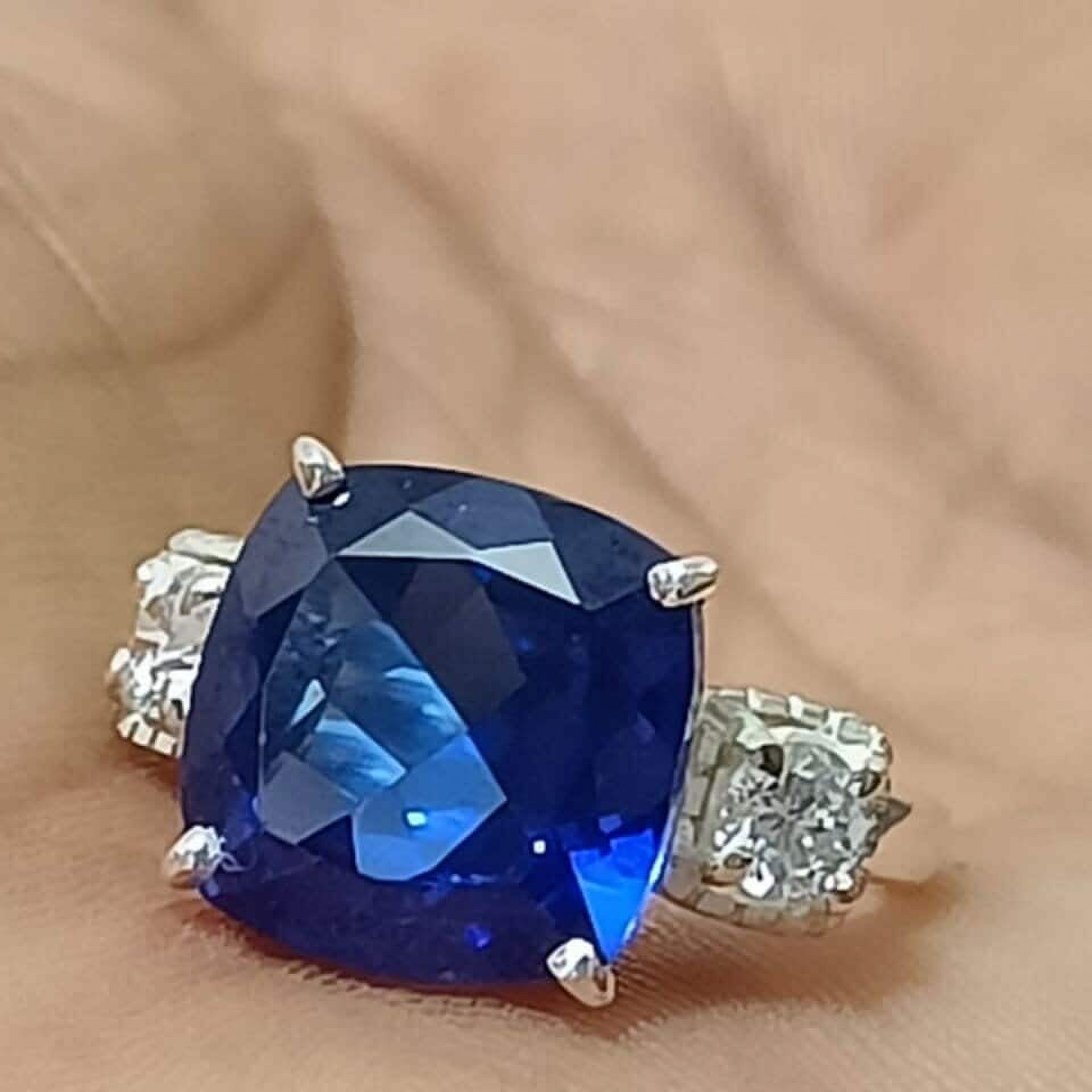 3 carat elongated cushion lab-created blue sapphire with two flanking Blue White Sapphire Elongated Cushion Engagement Ring