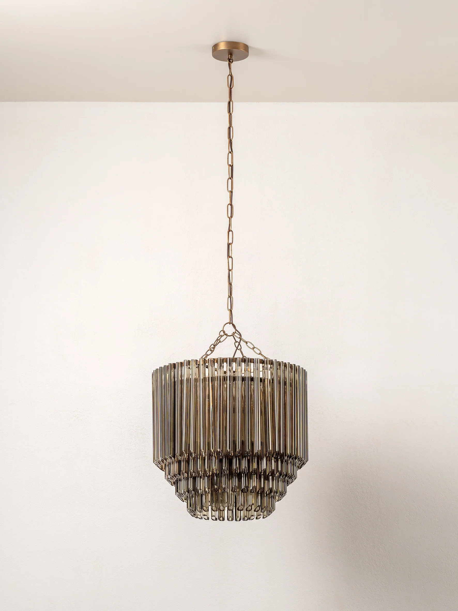 Petalia - 9 light aged brass and smoked green glass tube tall chandelier